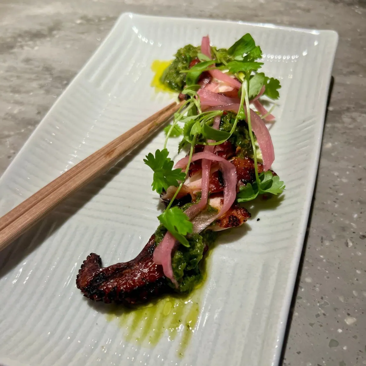 Grilled tako with Asian herb pesto and pickled onions